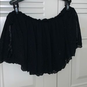 a black off the shoulder black shirt